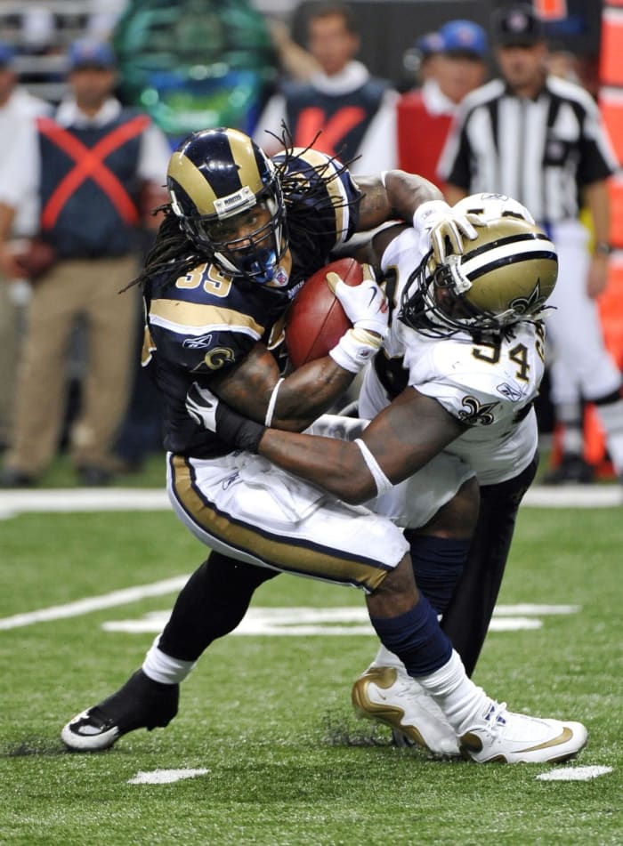 St. Louis Rams running back Steven Jackson (39) is tackled for a loss by New Orleans Saints defensive end Charles Grant (94). Mandatory Credit: Photo by Scott Rovak-USA TODAY